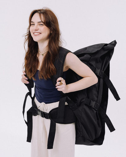 Model wearing ATACH Backpack — side